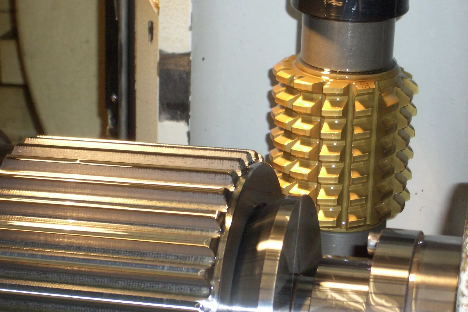 Shaft being gear-cut with a hob