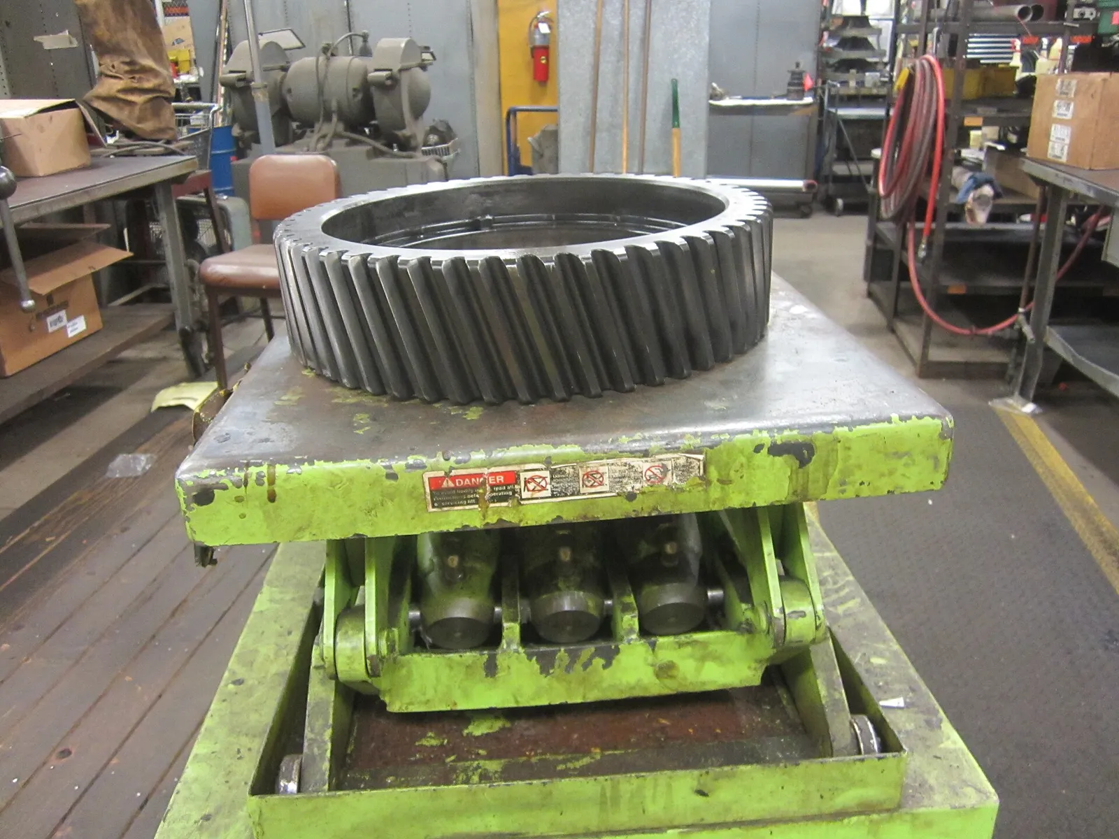 Machined gear wheel on a lifting platform