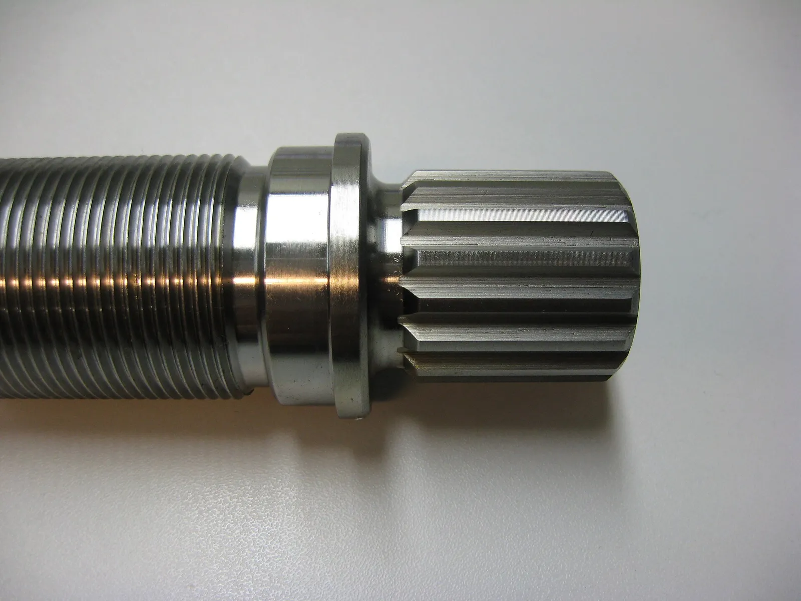 Machined steel shaft end with a keyway